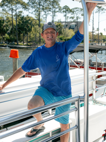 a man standing in front of a boat
